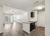 Thumbnail 11 of 31 - A kitchen with a sink and a fan at The Parkway at Hunters Creek, Orlando, 32837