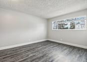 Thumbnail 17 of 45 - A room with a grey floor and a picture on the wall at Spyglass Creek, Denver, 80224