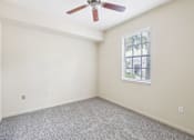 Thumbnail 33 of 64 - A room with a ceiling fan and a window. at The Dakota, Jupiter, FL, 33458