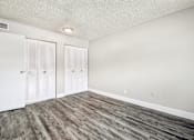 Thumbnail 24 of 45 - A room with wood flooring and white walls at Spyglass Creek, Denver, 80224