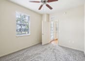 Thumbnail 29 of 64 - A room with a ceiling fan and a window with blinds. at The Dakota, Florida, 33458