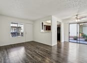 Thumbnail 22 of 47 - A room with wooden floors and white walls at Del Coronado Apartment , Arizona