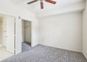 Thumbnail 35 of 64 - A room with a ceiling fan and carpeted floor. at The Dakota, Florida, 33458