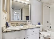 Thumbnail 13 of 51 - a bathroom with a sink and a mirror and a toilet at The Glen at Highpoint, Dallas, 75243