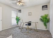 Thumbnail 10 of 51 - a home office with a desk and a ceiling fan at The Glen at Highpoint, Dallas, 75243