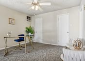 Thumbnail 12 of 51 - a living room with a desk and a ceiling fan at The Glen at Highpoint, Dallas, 75243