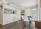 Thumbnail 5 of 51 - a living room and dining room with a table and chairs at The Glen at Highpoint, Dallas, 75243