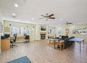 Thumbnail 18 of 32 - A spacious living room with a fireplace and a television. at Cedar Springs Apartments, Raleigh, NC