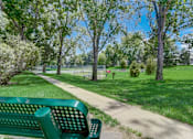 Thumbnail 41 of 50 - Bench with a  dog park in the background at Governor's Park, Fort Collins, 80525