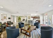 Thumbnail 17 of 35 - A living room with a dining table and chairs. at Sarasota South Apartments, Bradenton, 34207