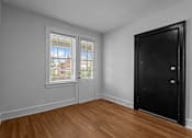 Thumbnail 21 of 34 - A room with a black door and a window with blinds.at The Collection of Historic Richmond, Richmond Virginia