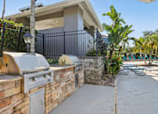Thumbnail 25 of 36 - Outdoor grilling stations with built in bbq grills at The Arbor Walk Apartments, Tampa, Florida