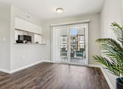 Thumbnail 21 of 51 - a living room with a sliding glass door and a window at The Glen at Highpoint, Dallas, 75243