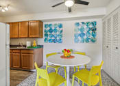 Thumbnail 6 of 45 - A kitchen with a table and chairs at Spyglass Creek, Denver, 80224