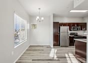 Thumbnail 25 of 105 - A kitchen with a refrigerator, microwave, and oven at Sweetwater At Metro North Apartments, Phoenix