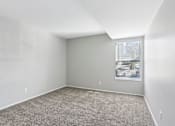 Thumbnail 30 of 57 - A room with a carpeted floor and a window with blinds. at Millennium at Creve Coeur, Missouri, 63141
