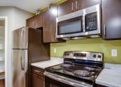 Thumbnail 2 of 17 - Electric Range In Kitchen at Heritage at Hidden Creek, Colorado Springs, CO, 80918