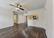 Thumbnail 15 of 41 - A room with a ceiling fan and wooden flooring. at University Park Apartments, Orlando, FL