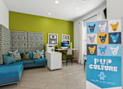 Thumbnail 30 of 36 - Pet friendly lounge with playful dog art at The Arbor Walk Apartments, Tampa, FL