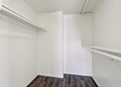 Thumbnail 33 of 47 - A white room with a wooden floor and a white door at Del Coronado Apartment , Arizona, 85202