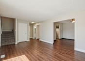 Thumbnail 4 of 56 - A room with wooden floors at Aspen Townhomes, Colorado Springs, CO