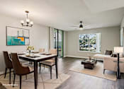 Thumbnail 1 of 55 - A modern dining room with a glass table and chairs. at Lakeside Glen Apartments, Florida, 32904
