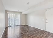 Thumbnail 24 of 57 - A room with wooden floors and a white door. at Millennium at Creve Coeur, Creve Coeur