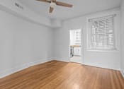Thumbnail 17 of 34 - A room with a wooden floor and a ceiling fan.at The Collection of Historic Richmond, Virginia, 23220