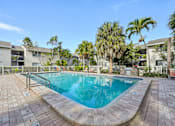 Thumbnail 33 of 35 - A small pool surrounded by a brick patio. at Sarasota South Apartments, Bradenton, FL