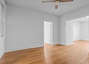 Thumbnail 19 of 34 - A room with a ceiling fan and wooden floors.at The Collection of Historic Richmond, Richmond, VA