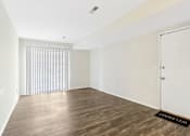 Thumbnail 39 of 57 - A room with wooden flooring and a white door. at Millennium at Creve Coeur, Missouri, 63141