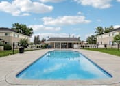 Thumbnail 35 of 56 - A large outdoor swimming pool at Aspen Townhomes, Colorado Springs, CO