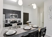 Thumbnail 7 of 65 - Modern Kitchen with dining table at The View at Old City, Philadelphia
