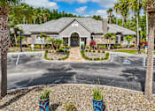 Thumbnail 14 of 31 - A building with a grey roof and a sign on it at The Parkway at Hunters Creek, Orlando, 32837