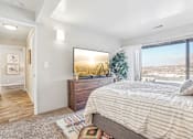 Thumbnail 18 of 62 - A bedroom with a large bed and a view of the mountains outside the window. at Cliffs at Canyon Ridge, Utah, 84401