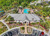 Thumbnail 16 of 31 - A large house with a pool in the backyard at The Parkway at Hunters Creek, Orlando, 32837