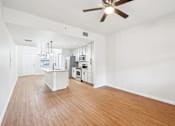 Thumbnail 9 of 64 - A kitchen with white cabinets and a wooden floor. at The Dakota, Jupiter, FL, 33458