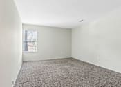 Thumbnail 31 of 57 - Empty room with carpeted floor and a window. at Millennium at Creve Coeur, Creve Coeur