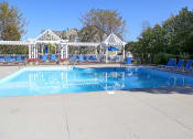 Thumbnail 18 of 20 - a swimming pool with chairs around it and a house in the background at Brookstone Village, Cincinnati