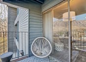 Thumbnail 23 of 62 - A white fan is on a patio with a view of the mountains. at Cliffs at Canyon Ridge, Utah, 84401