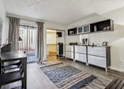 Thumbnail 17 of 47 - A living room with a dining table and chairs at Del Coronado Apartment , Mesa, AZ