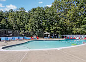 Thumbnail 45 of 70 - A large outdoor swimming pool at Heritage at the River, Manchester, NH