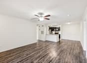 Thumbnail 7 of 31 - A room with a ceiling fan and wooden flooring at The Parkway at Hunters Creek, Orlando, 32837