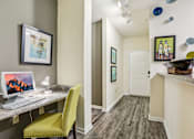 Thumbnail 5 of 36 - Home workspace nook with computer desk and entryway at The Arbor Walk Apartments, Tampa, FL