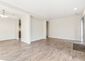 Thumbnail 27 of 62 - A spacious room with wooden flooring and white walls. at Cliffs at Canyon Ridge, Utah, 84401