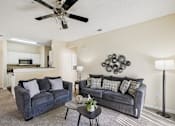 Thumbnail 3 of 32 - A living room with two couches and a ceiling fan. at Cedar Springs Apartments, Raleigh, 27609