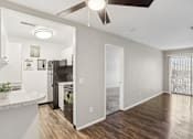 Thumbnail 20 of 57 - A modern kitchen with a refrigerator, oven, and a ceiling fan.at Creve Coeur, Creve Coeur, 63141