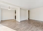 Thumbnail 31 of 62 - A room with wooden flooring and white walls. at Cliffs at Canyon Ridge, Utah, 84401
