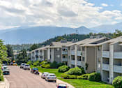 Thumbnail 8 of 37 - Apartment buildings on a street with mountains in the background  at Union Heights Apartments, Colorado Springs, CO