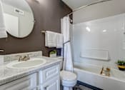 Thumbnail 6 of 37 - Bathroom with a sink toilet and bath tub  at Union Heights Apartments, Colorado Springs, CO